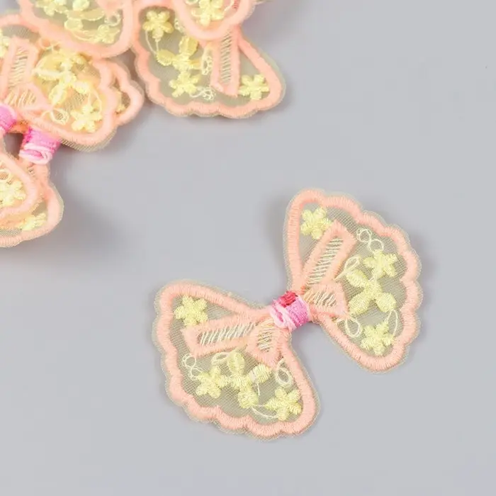 Декор для творчества текстиль вышивка "Бантик в цветочках оранжево-жёлтый" 7х5,5 см