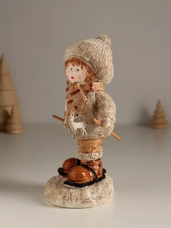 Сувенир полистоун "Малыш в вязаном наряде на мини-лыжах" 8,5х8х17,5 см