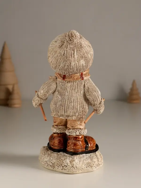 Сувенир полистоун "Малыш в вязаном наряде на мини-лыжах" 8,5х8х17,5 см