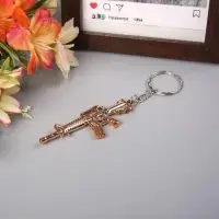 Брелок пластик под металл "Автомат" 2,5х7 см