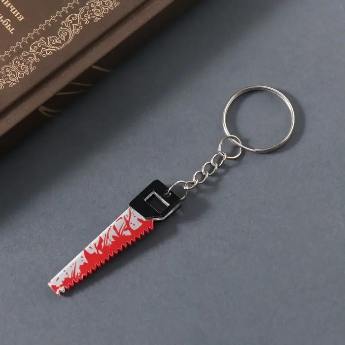 Брелок акрил зеркальный "Окровавленная пила" 5,1х1,3х0,3 см