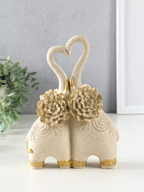 Сувенир полистоун " Парочка слонов с цветочными ушами" песочный 8х17х25,5 см