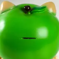 Копилка "Кот в костюме яблоко"зелёный, 21х17х17 см