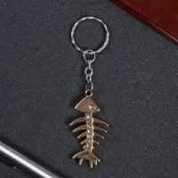 Брелок пластик под металл "Скелет рыбы" 2,5х5 см