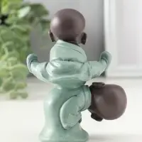 Сувенир полистоун "Маленькие будды - игра в чехарду" зелёно-коричневый 4,7х9,3х11 см