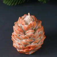 Свеча "Шишка 80х60 мм с оранжевым декором