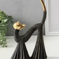 Сувенир полистоун "Кошка в клёшах" чёрно-золотая 7,5х15х25 см