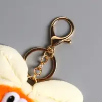 Пушистик на кольце "Чучундра с бантиком" оранж 18х10х5 см