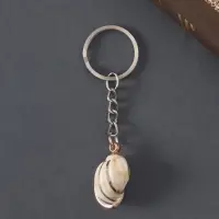 Брелок пластик "Ракушка в клетку" с золотом 3х2х1,2 см