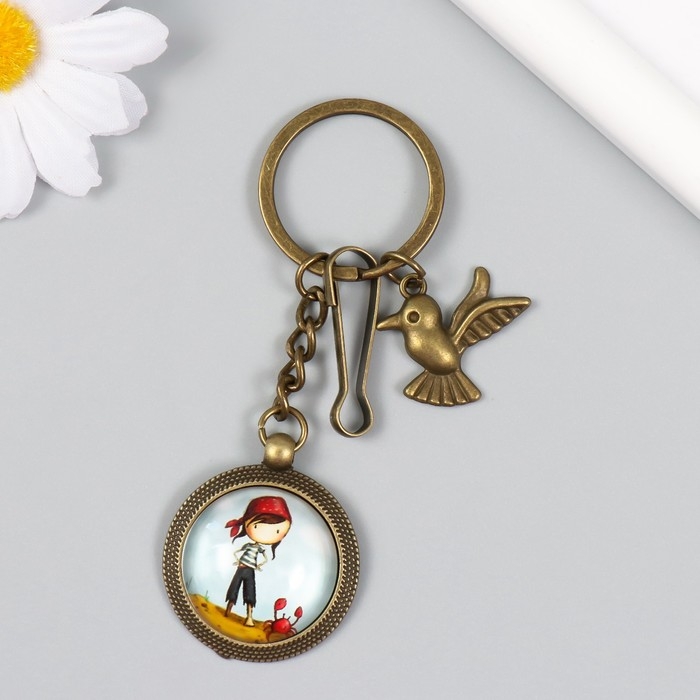 Брелок металл, стекло с карабином "Птица и девочка-пиратка в медальоне" бронза 9,5 см