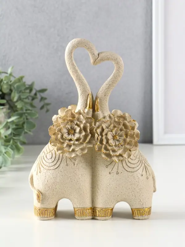 Сувенир полистоун " Парочка слонов с цветочными ушами" песочный 8х17х25,5 см