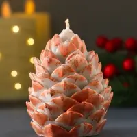 Свеча "Шишка 80х60 мм с оранжевым декором